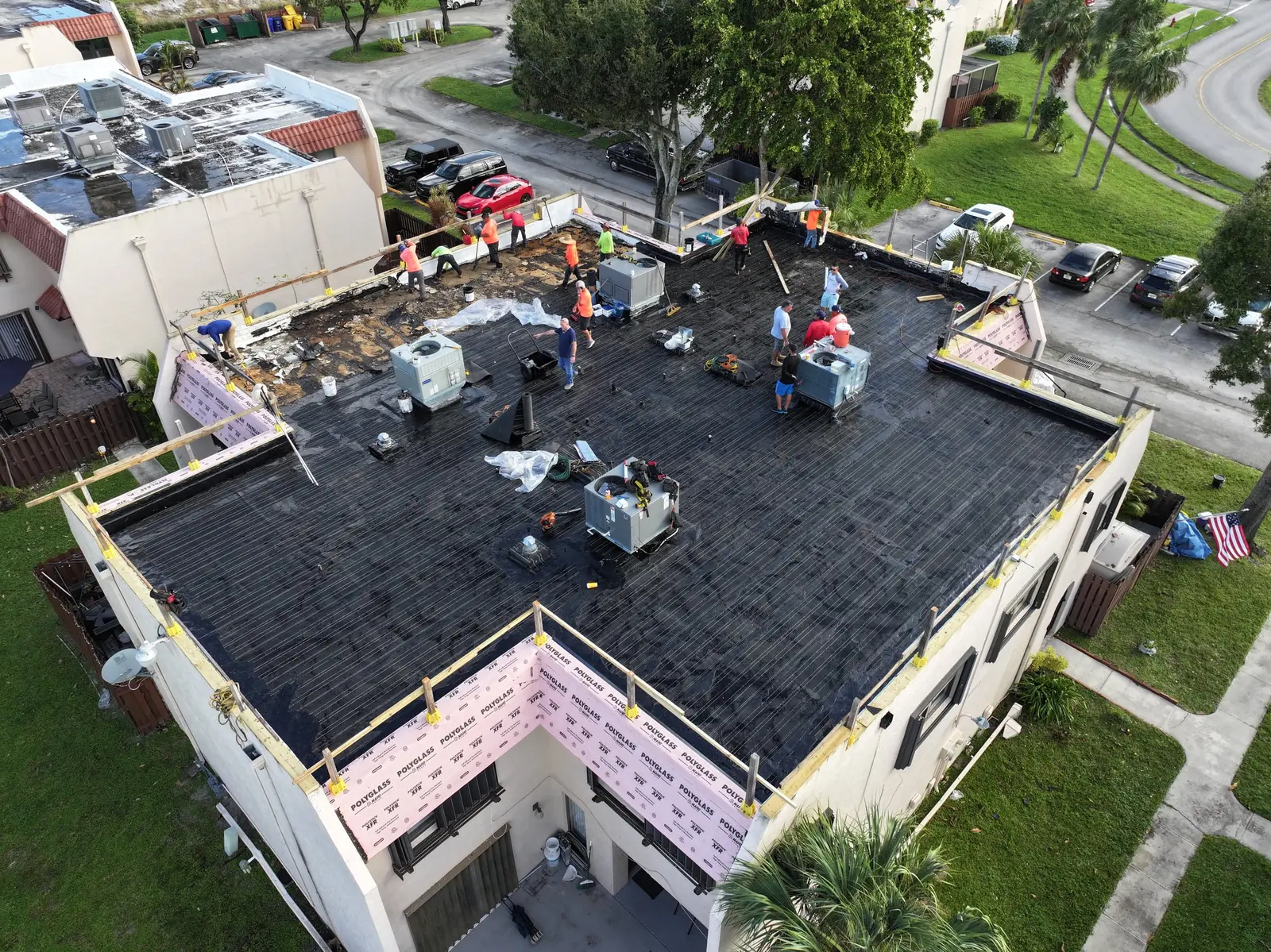Millennium Makeover crew working on a condominium flat roof