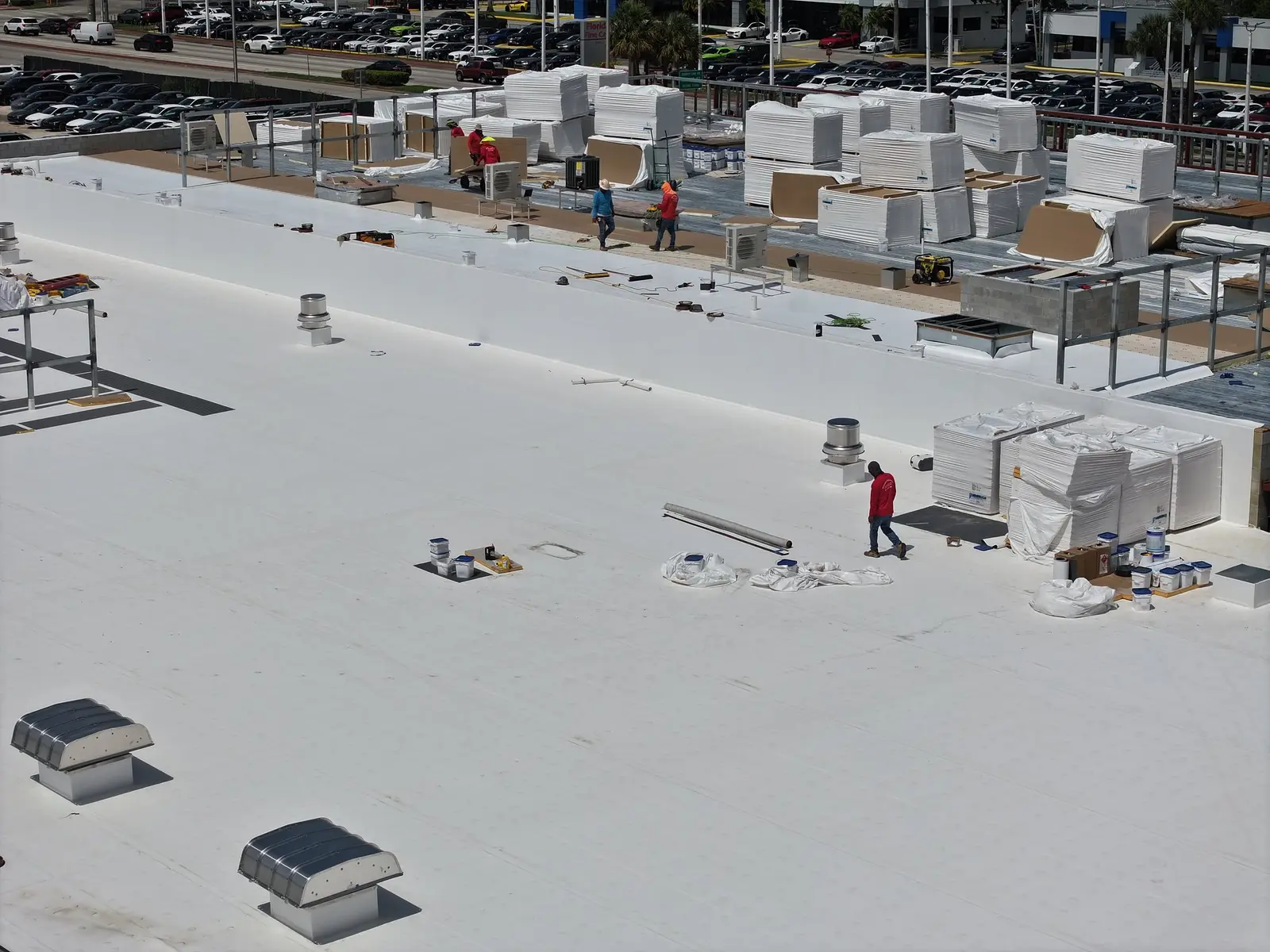 Millennium Makeover crew working on a commercial TPO roof