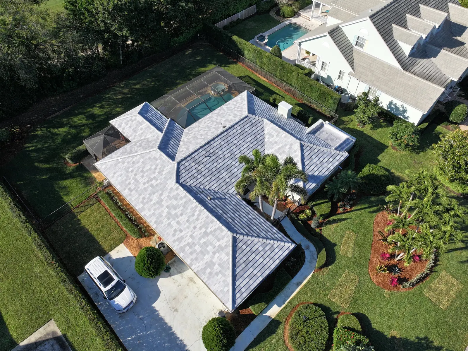 Aerial view of a South Florida home with a tile roof by Millennium Makeover