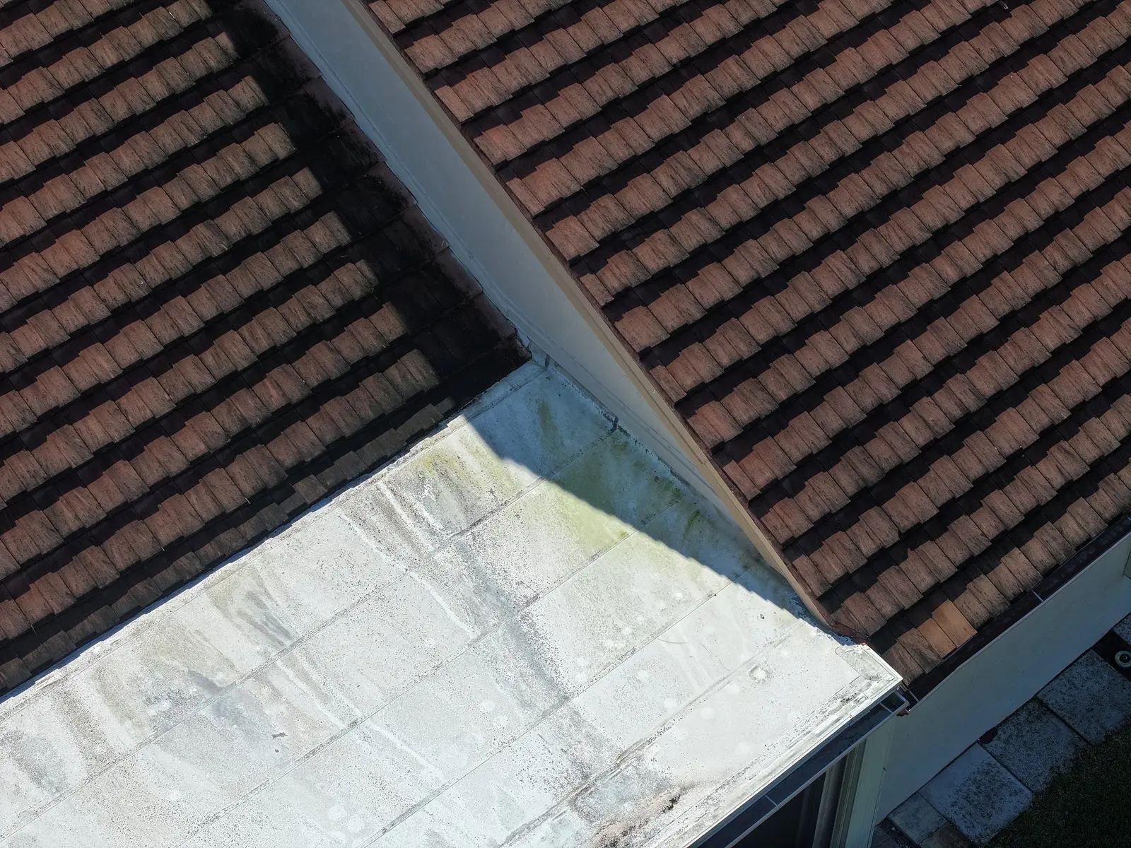 Drone inspection close-up of clay tile roof conditions